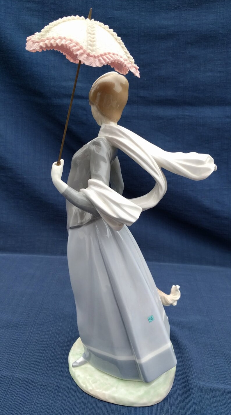 lladro lady with parasol and dog