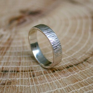 Handmade, sterling silver, wedding ring set featuring a tree bark texture. By Curious Magpie Jewellery.