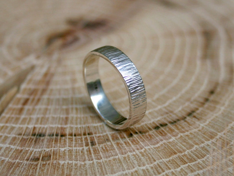 Handmade, sterling silver, wedding ring set featuring a tree bark texture. By Curious Magpie Jewellery.