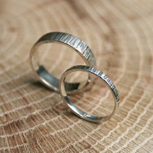 Handmade, sterling silver, wedding ring set featuring a tree bark texture. By Curious Magpie Jewellery.