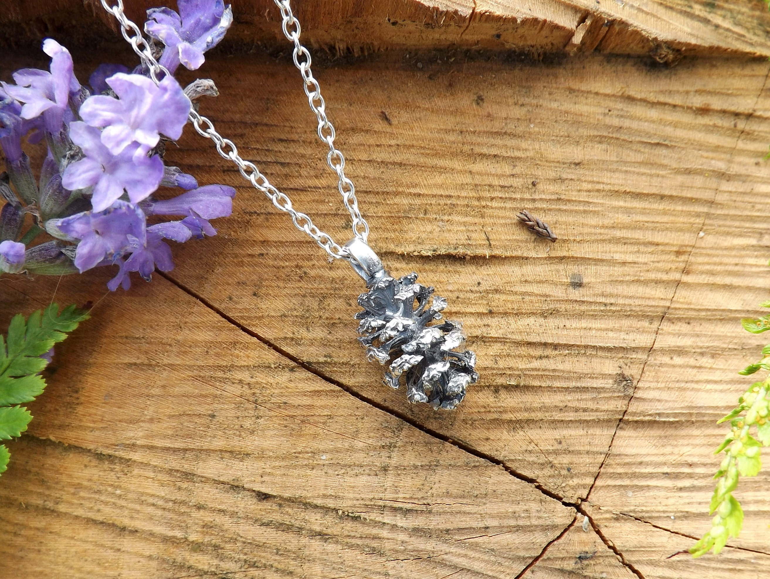 Silver pinecone best sale necklace