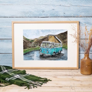 May include: A watercolour painting of a blue camper van parked on a winding road in a mountainous landscape. The van has a pop-up roof and is surrounded by green hills and a cloudy sky.