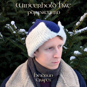 May include: A handmade Winterhold hat pattern in a close-up shot. The hat is two-toned, with a white and navy blue design. The text "Winterhold hat pdf pattern" is at the top of the image. The brand name "heidrun crafts" is at the bottom.