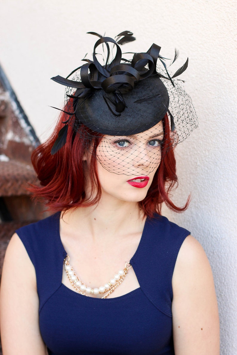 black dress with fascinator