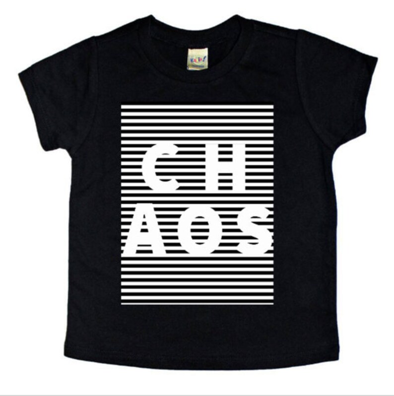 May include: Black t-shirt with white stripes and the word "CHAOS" printed in white letters.