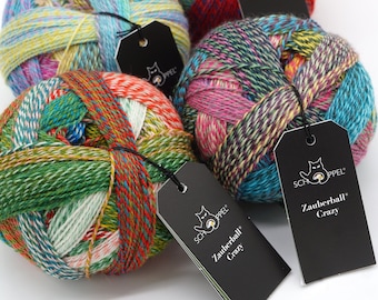 May include: Four balls of colorful yarn with black tags that say "Zauberball Crazy" and "Schappel".