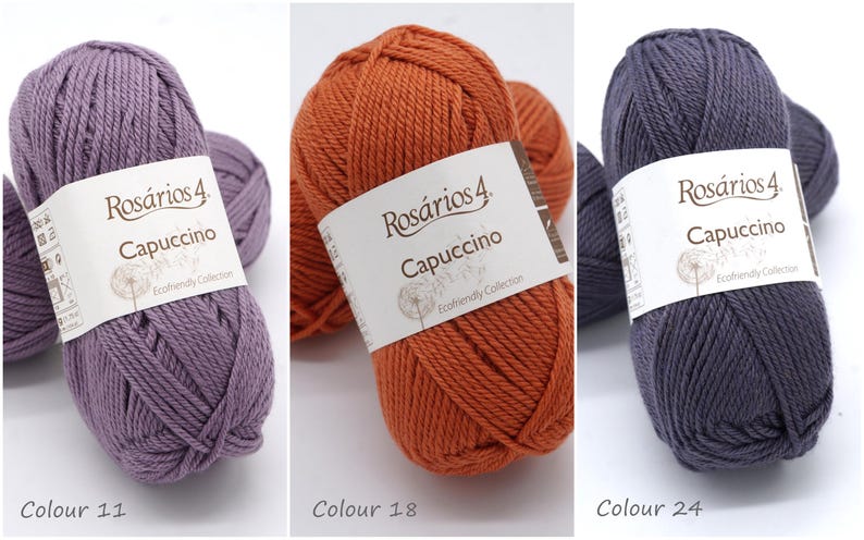 May include: Three balls of yarn in different colours: purple, orange, and grey. Each ball has a label that reads "Ros&aacute;rios 4. Capuccino Ecofriendly Collection".