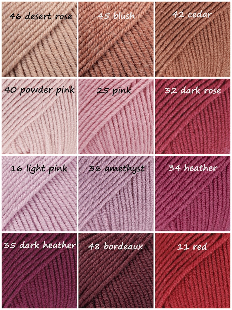 May include: A collection of yarn skeins in various shades of pink, red, and brown. The skeins are arranged in a grid pattern with the color number and name printed on each skein.