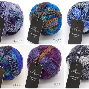 May include: Six balls of yarn in various color combinations, including purple, blue, green, brown, gray, and white. Each ball has a black tag with the text "Zauberball Crazy" and a number.