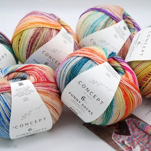 Pode incluir: Cinco novelos de lã colorida com etiquetas que dizem "Concept by Katia 6ply Funny Socks".