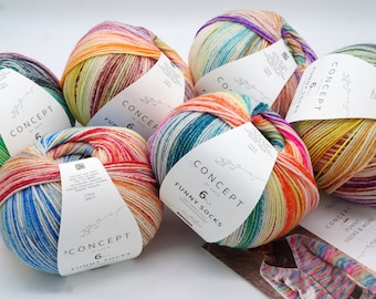 May include: Five balls of colorful yarn with labels that say "Concept by Katia 6ply Funny Socks".