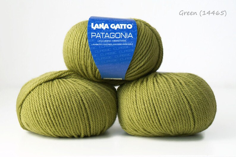 May include: Three balls of green yarn, labeled "LANA GATTO PATAGONIA" in blue. The yarn is a medium weight and is machine washable.