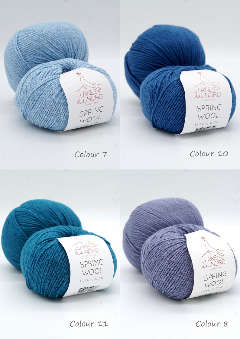 May include: Four skeins of yarn in different shades of blue. The yarn is labeled "Laines du Nord Spring Wool Luxury Line".