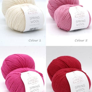 May include: Four skeins of yarn in different colors: white, light pink, hot pink, and red. Each skein has a label that says "Laines du Nord" and "Spring Wool Luxury Line".