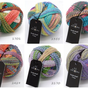 May include: Six balls of colorful yarn with labels that say "Zauberball Crazy" and a number. The yarn is a mix of green, blue, purple, pink, yellow, and orange.