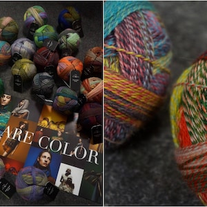 May include: A close-up of colorful yarn balls with a variety of textures and patterns. The yarn is arranged in a circle on a dark surface. The text "WE ARE COLOR" is visible in the background.