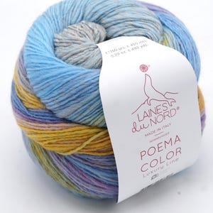 May include: A ball of Poema Color yarn by Laines du Nord, in shades of blue, yellow, and purple. The label states 150 grams and 450 metres of yarn. The yarn is made in Italy.
