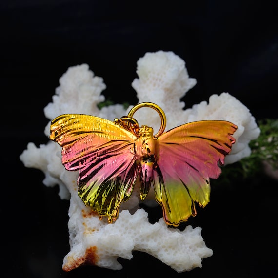 A real butterfly wing preserved and encased in electroformed copper — nature and metalwork fused into a piece of jewelry you genuinely cannot find anywhere else.