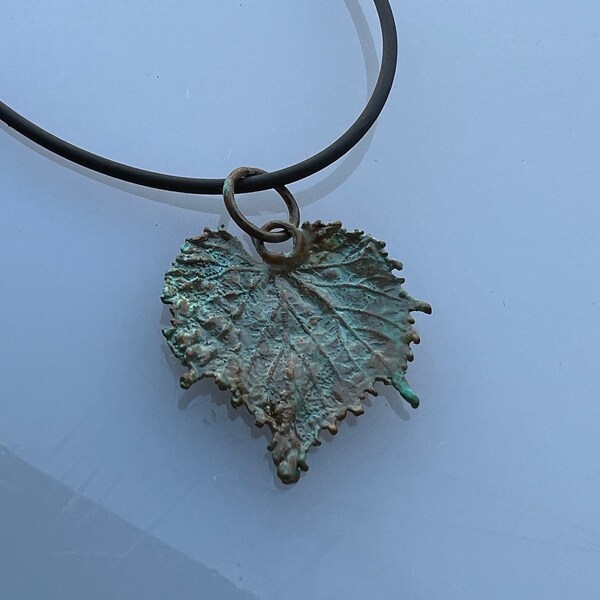 Botanical jewelry: real grape leaf electroformed with copper. Malachite patina.