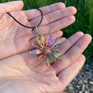 Botanical jewelry: real topinambur flower electroformed with bright rainbow patina