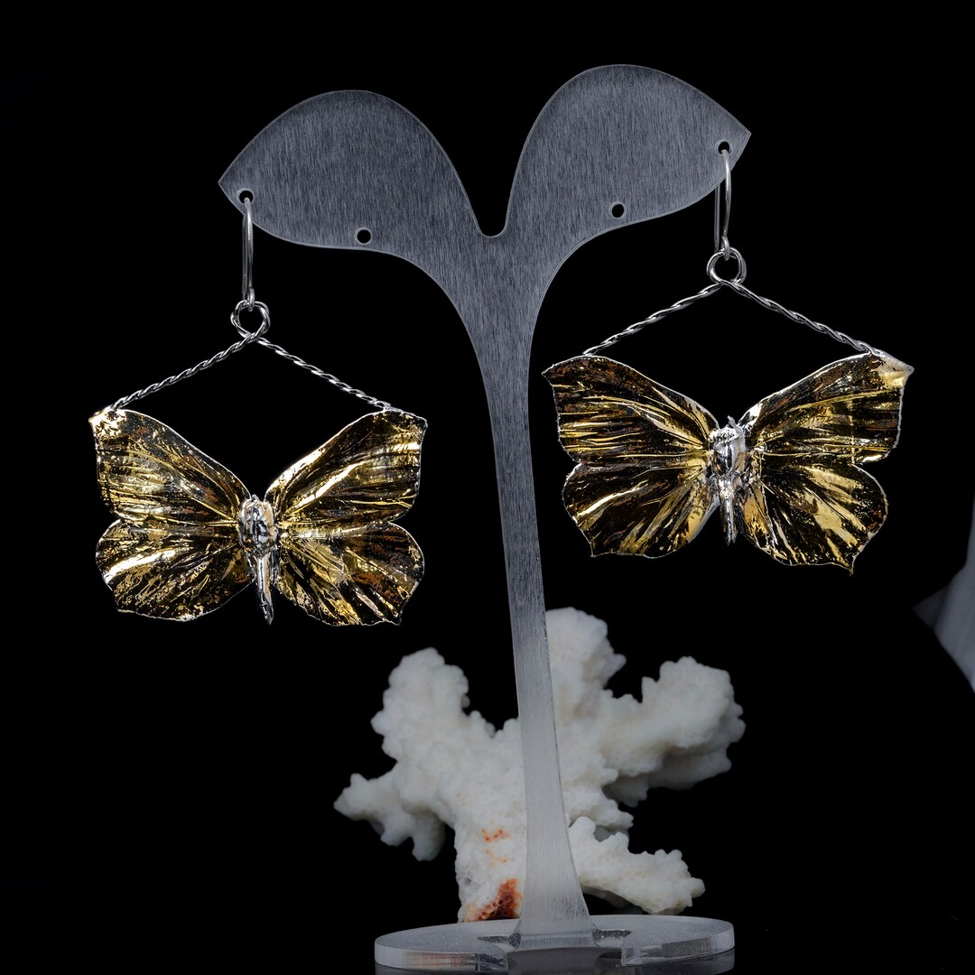 Pendient de mariposa con flor de cristal, aret de clip para oreja - China Accorios para orejas y Pendient precio