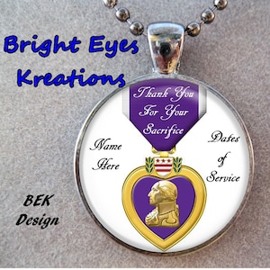 May include: A round, silver pendant with a purple heart medal design. The medal features a profile of George Washington, a purple ribbon with the text "Thank You For Your Sacrifice", and three stars. The pendant is on a silver chain and has the text "Name Here" and "Dates of Service" around the edge.