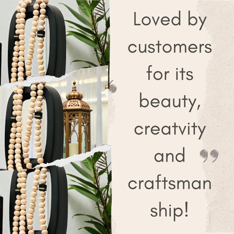 May include: Black metal decorative wall art with a beaded garland. A gold lantern and green plant are visible in the background. Text reads "Loved by customers for its beauty, creativity and craftsmanship!"