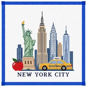May include: A cross-stitch pattern featuring the Statue of Liberty, a yellow taxi, a red apple, and New York City skyscrapers. The design includes the text NEW YORK CITY in dark blue block letters, all framed by a bright blue border on white fabric.