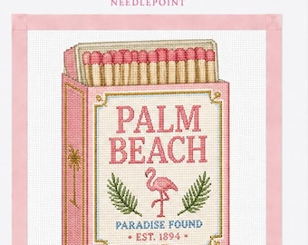 May include: A needlepoint canvas featuring a pink matchbox design with the text PALM BEACH, PARADISE FOUND, and EST. 1894. The design includes a pink flamingo, green palm fronds, and a row of matches with pink tips at the top of the box.