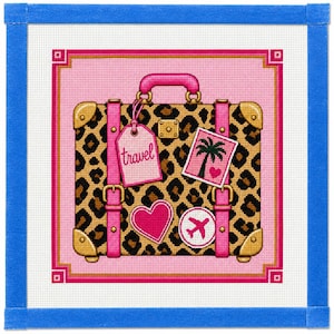 May include: A needlepoint canvas featuring a leopard print suitcase with a pink handle and straps. The suitcase is decorated with a pink luggage tag labeled travel, a palm tree sticker, a pink heart, and a white circle with a pink airplane icon.