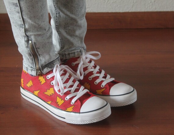 red shoes with lightning bolt