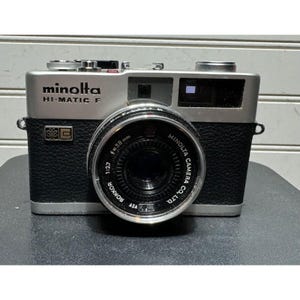 Vtg  Minolta Hi-matic F Rokkor 38mm f2.7 35mm film camera with new batteries READ DESCRIPTION