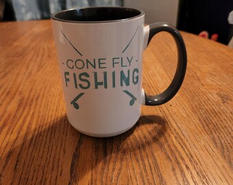 Taza de café de pesca con mosca desaparecida