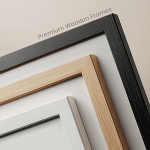 three different wooden frames, each with a unique color and design, arranged in a row.