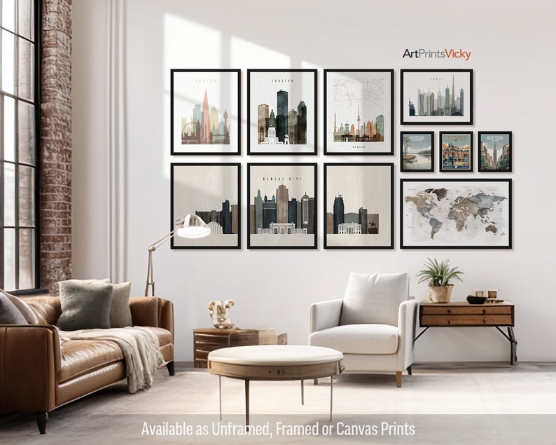 a living room filled with furniture and pictures on the wall