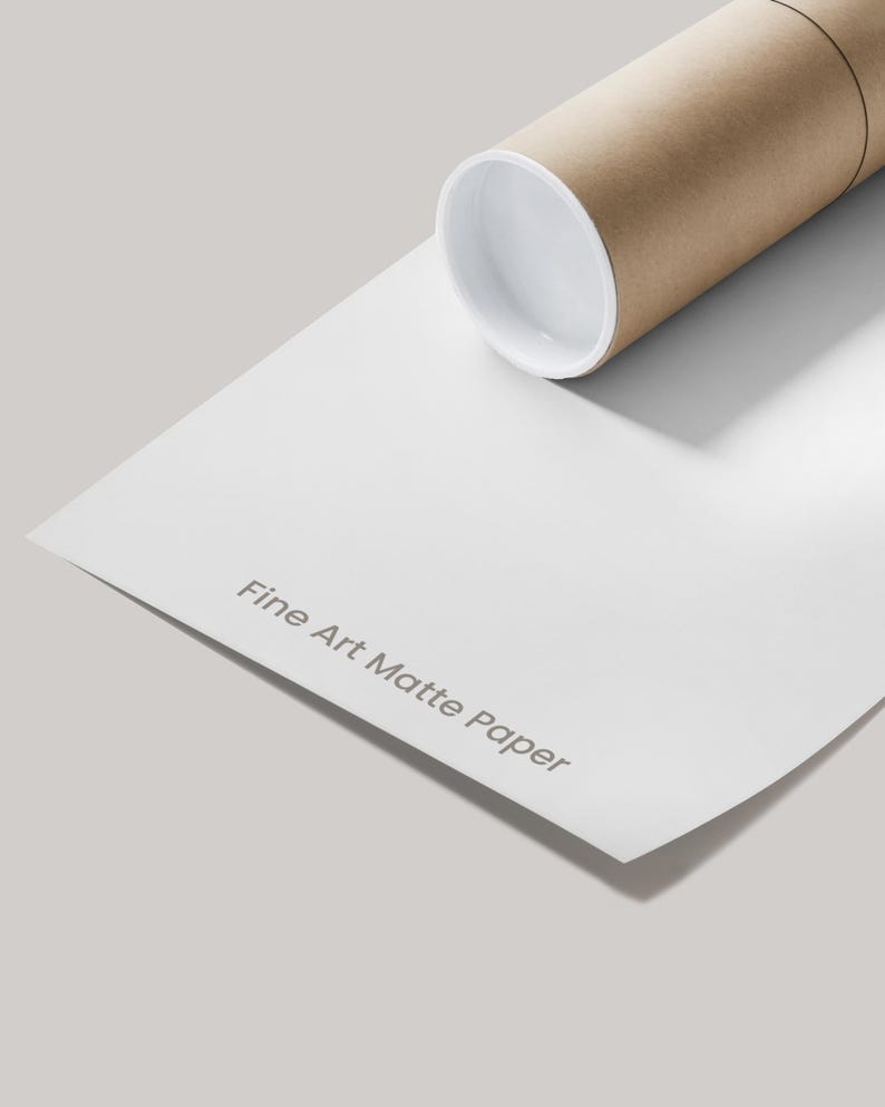 A roll of white matte paper with the text "Fine Art Matte Paper" printed on it, placed on a plain white surface.