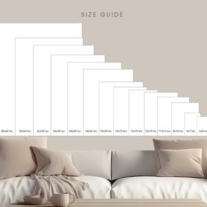 a white couch sitting next to a coffee table