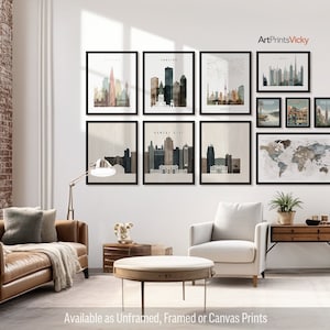 a living room filled with furniture and pictures on the wall