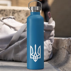 May include: A blue stainless steel water bottle with a white trident symbol. The bottle has a screw-on lid and a carrying handle.
