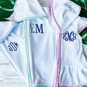 Monogram swimsuit bottoms in its Monogram rubber pouch. …