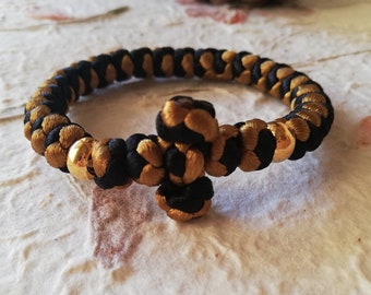 Black gold komboskini bracelet for hand