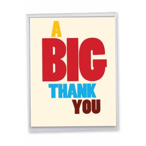May include: A rectangular greeting card with a cream-colored background featuring the text A BIG THANK YOU. The word A is yellow, BIG is in large red letters, THANK is in blue, and YOU is in dark brown, all centered on the card.