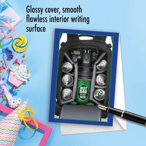 May include: Greeting card with a blue border featuring a black camera bag filled with beer cans and a green can that says "Best Dad Premium Beer." The card has the text "Glossy cover, smooth flawless interior writing surface."