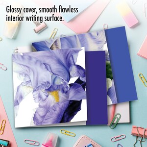 May include: A set of three notebooks with a glossy cover and a smooth writing surface. The cover features a watercolor illustration of a purple iris flower.