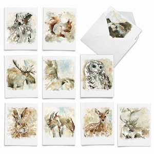 May include: Set of eight watercolor greeting cards featuring various woodland animals, including an owl, a deer, a moose, a squirrel, a rabbit, a fox, and two different types of birds. The cards are all white with a light brown background and are perfect for sending a special message to someone you care about.