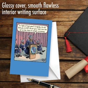 May include: A humorous graduation card featuring a cartoon illustration of Vikings wearing graduation caps and gowns. The text reads: "In light of last year's tragedy, we ask that you do NOT throw your hats into the air at the close of today's ceremony."