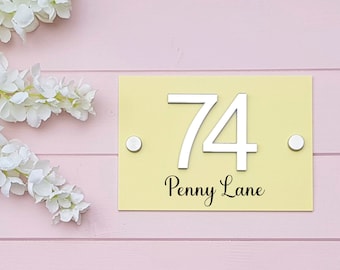 Acrylic house number sign personalised in a choice of colours with 3d mirrored numbers. Vinyl street or house name