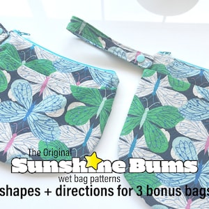 May include: Two wet bags with butterfly patterns. The bags are made of fabric and have a zipper closure. The bags are labeled "The Original Sunshine Bums wet bag patterns" and "2 shapes + directions for 3 bonus bags!"