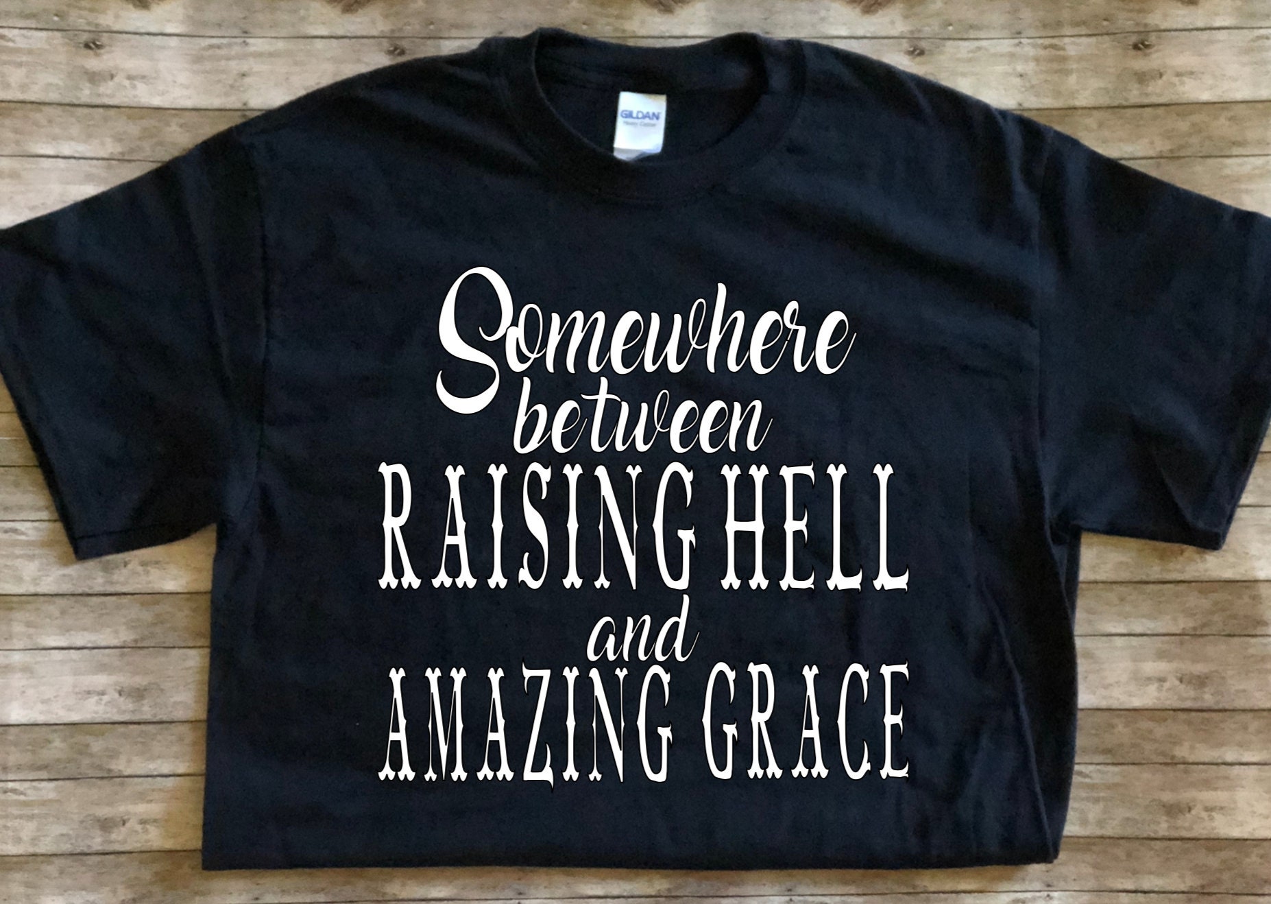 somewhere between raising hell and amazing grace t shirt