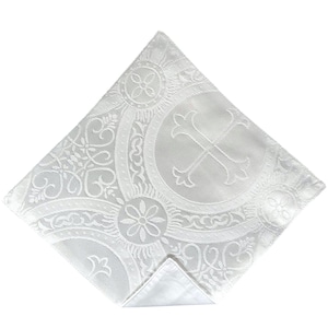 May include: White fabric pocket square with an embossed design of a cross and floral patterns.